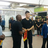 Sifu David Mckenzie receiving gift from Sifu Sam Lau.