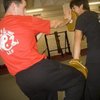 Sifu Ben practices Pad Drills with David